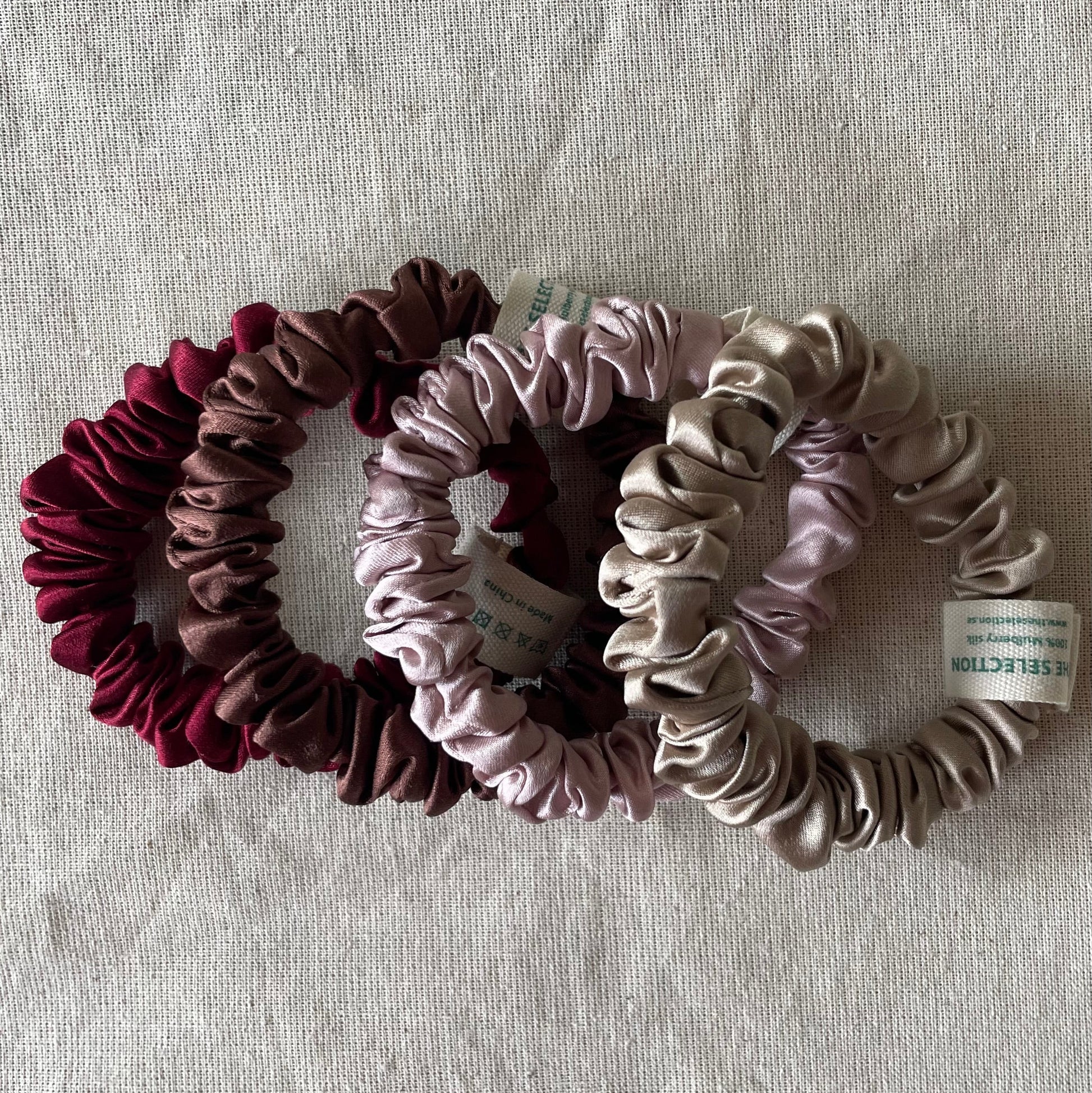 Four 100% 30 momme silk scrunchies in 1 cm wide with dusty pink,Bordeaux,chocolate brown,nude colors