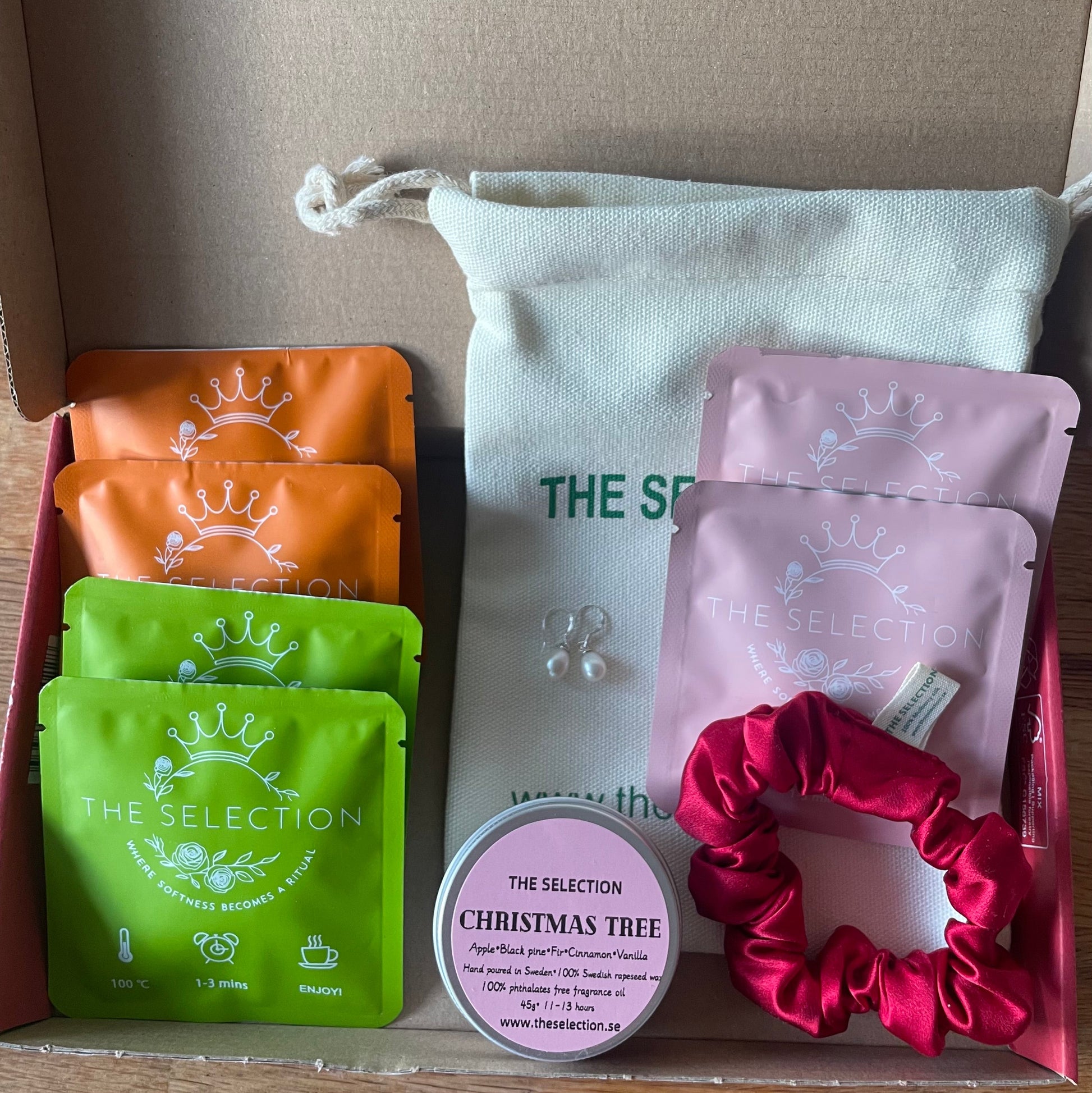 Gift box with 6 herbal loose leaf tea, 1 pure Swedish rapeseed scented candle,1 30 momme silk scrunchie And 1 pair of freshwater pearl earrings with 925 sterling silver hooks 