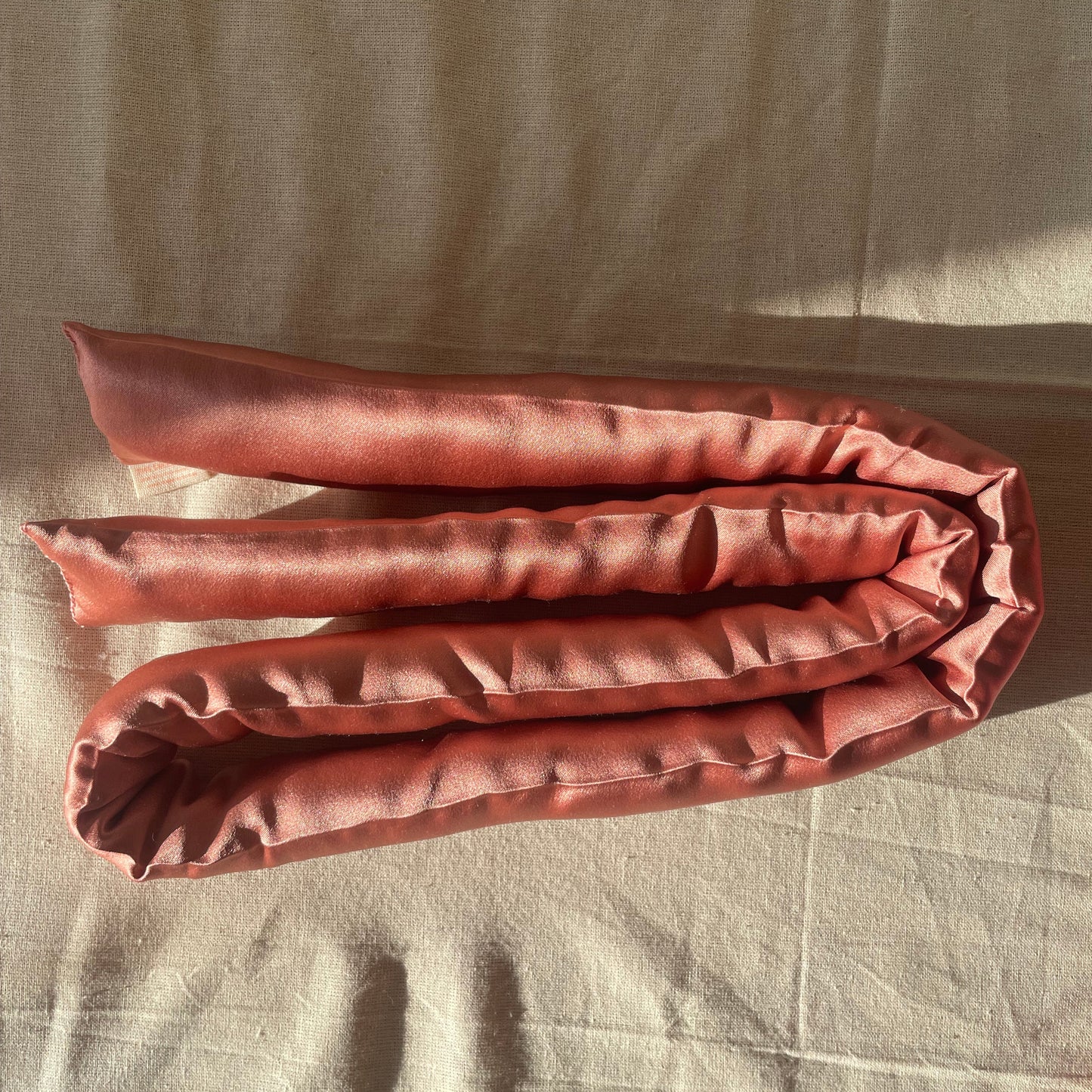 30 momme silk overnight curler with 100%  cotton filling, 1 m long in rosegold color. Handmade in Sweden 